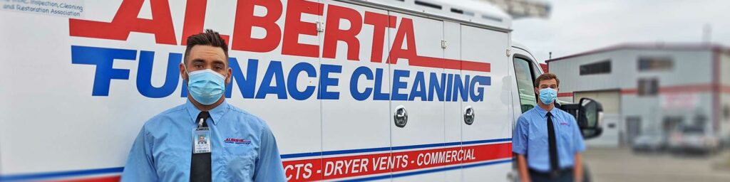 A professional with a COVID-19 mask from Alberta Furnace Cleaning in front of company truck in Calgary, Alberta.