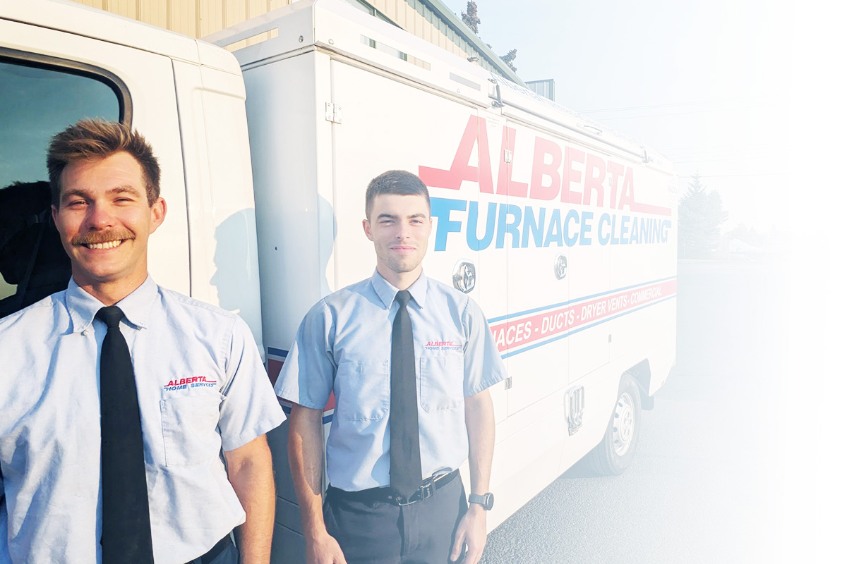 Alberta Furnace Cleaning Alberta Furnace Cleaning Technicians standing in front of a furnace and duct cleaning truck